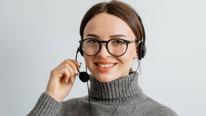 female-with-specs-holding-mic