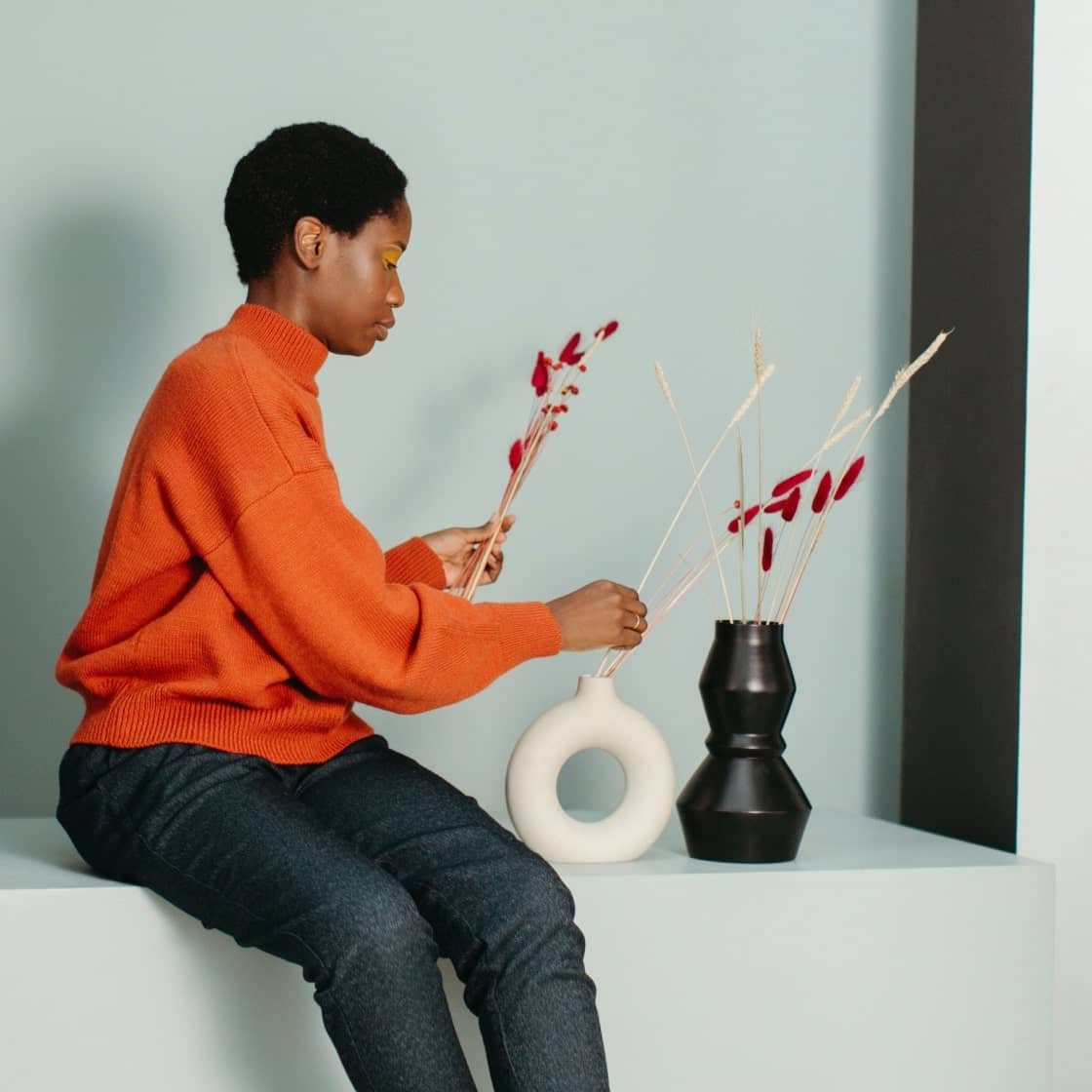 Women decorating flower pot